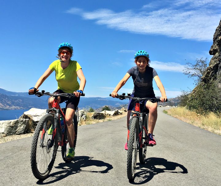 3 happy cyclists on a traffic free cycling path with on our Okanagan & Kettle Valley Railway Bike