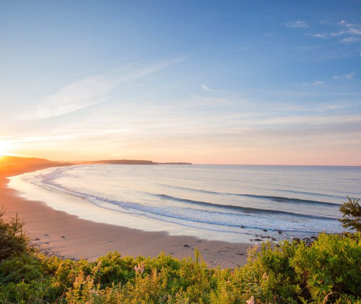 A typically beautiful sunset view of one of the beaches you will visit during the Mabou & Celtic Shores Coastal Trail cycling tour with Freewheeling Adventures.