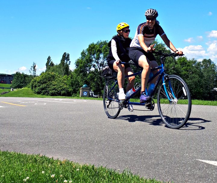 Cycling on a tandem bike on quiet roads and bike paths along the Navigator’s Route - the south shore of the Saint Lawrence River on our Bas-Saint-Laurent Bike with Freewheeling Adventures