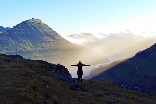 The Faroe Islands lie about halfway between Scotland and Iceland in the Atlantic Ocean. Consisting of 18 main islands and hundreds more islets and skerries, the rugged, rocky Faroes are best known for their bird cliffs and unspoiled landscapes.