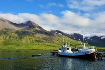 Wooden Icelandic fishing boat in Siglufjörður bay. Icelandic fjords.