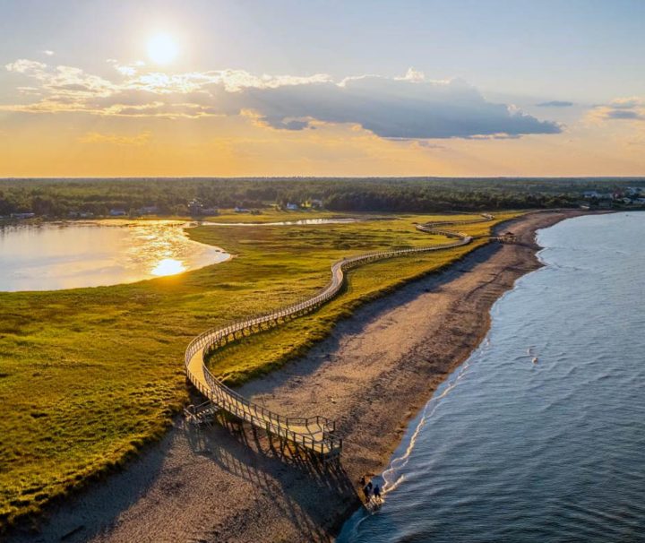 This image shows the Bouctouche Dune (La Dune de Bouctouche), a unique natural sand dune located on the Acadian coast of New Brunswick, Canada