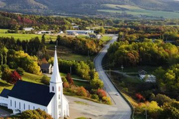 This image captures the village of Mabou in Cape Breton, Nova Scotia, surrounded by autumn foliage
