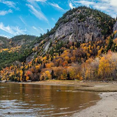 This image shows the Saguenay Fjord National Park in Quebec, Canada, during the autumn season