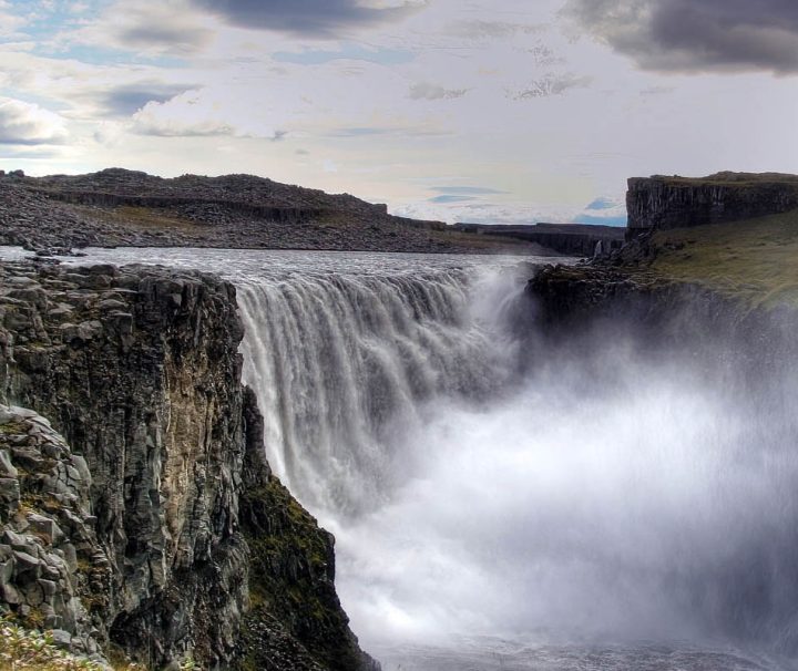 This image shows Dettifoss, a massive waterfall located in Vatnajökull National Park in Northeast Iceland