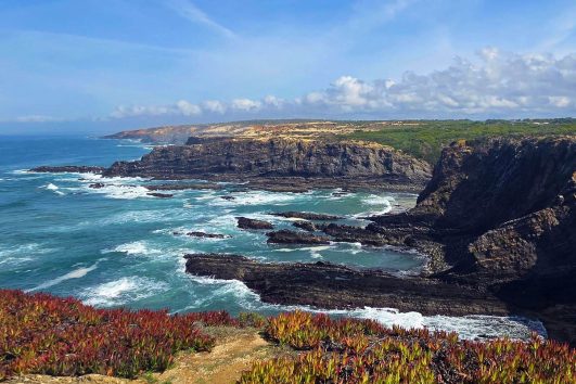 A scenic view of Cabo Sardão (Cape Sardao) in Portugal, a prominent headland located within the Southwest Alentejo and Vicentine Coast Natural Park