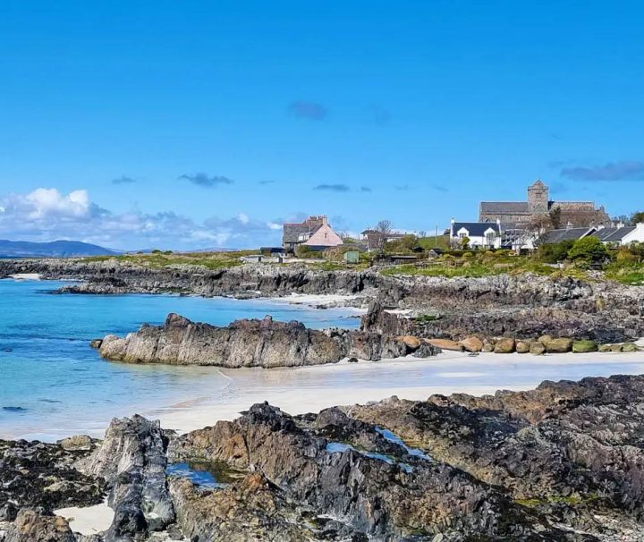 This image shows a scenic coastline on the Isle of Iona, a small island in the Inner Hebrides off the west coast of Scotland